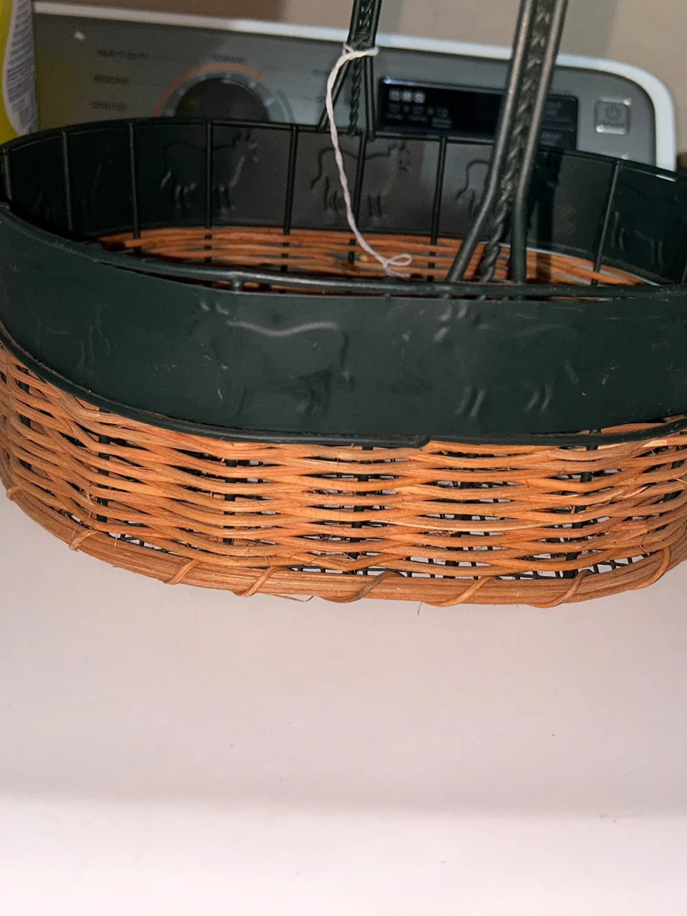 vintage oval gathering basket with a dark green metal frame.